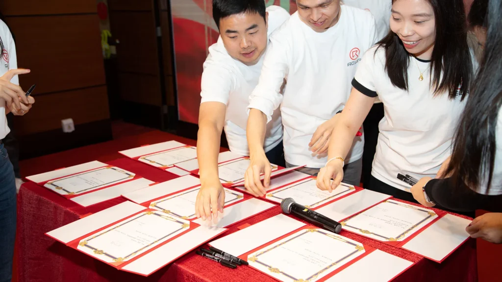 rewa tech hosts 2025 annual conference: empowering global electronics repair REWA Employee signing annual target