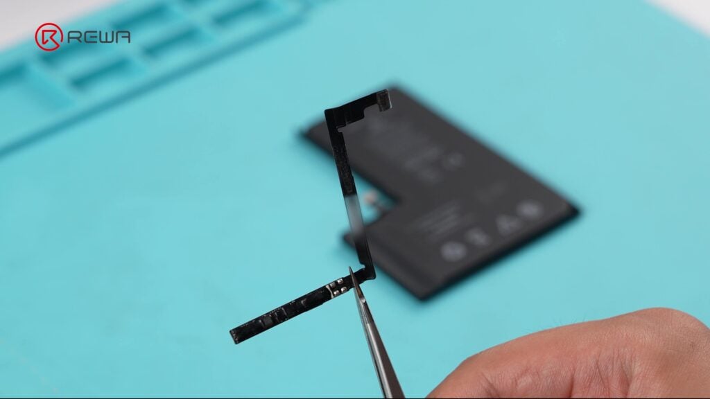 fix iphone unknown part message using diagnostic-compatible parts Holding a small circuit board that attached to every iPhone battery