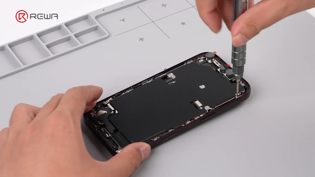 iphone 18 pro teardown: what changed inside and how does it affect repairability using a screwdriver to open iPhone 18 Pro for teardown