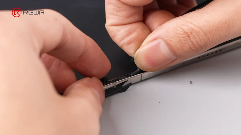 iphone duo teardown: double screens, double repair risk? the bracket attachment points are metal welded to the iPhones frame